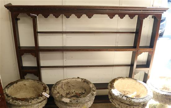 A mid 18th century oak plate rack W.163cm